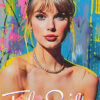 A woman with blonde hair, wearing a tiara and pearl necklace, poses in front of a colourful background, channeling Taylor Swift’s signature style. The name Taylor Swift appears at the bottom in elegant white script. Wall art print available in A1 to A4 sizes.