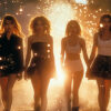 Four women walk side by side toward the camera at sunset, illuminated by glowing sparkles in the air, creating a dramatic and bright atmosphere. Cinematic-style teen attitude poster available in A1 to A4 sizes.