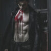 A male vampire with pale skin and dark hair stands indoors, shirtless under a long black coat, with blood covering his chest and abdomen. The lighting is dark and moody. Fantasy art poster available in A1 to A4 sizes.