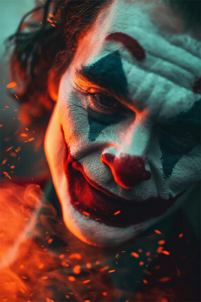 The Joker from Batman with dramatic clown makeup and red nose looks into the camera, illuminated by orange light and surrounded by floating embers. A striking scene. Fantasy art poster available in A1 to A4 sizes.