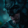 A close up of Batman, with a serious expression, wearing a black cowl and armour, set against a moody, blue-toned background with rain and bokeh lights. Fantasy art poster available in A1 to A4 sizes.