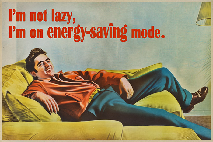 product-image-3-2 A man reclines on a couch, smiling, with text above him that reads "I'm not lazy, I'm on energy-saving mode." Funny poster available in A1 to A4 sizes.