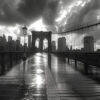 Wet Brooklyn Bridge in black and white, with dramatic clouds and sunlight breaking through over the Manhattan skyline in the background. Wall art print available in A1 to A4 sizes.