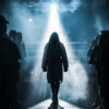 A person in a hooded robe walks toward a boxing ring, illuminated by a spotlight, with onlookers standing on either side in a smoky, dimly lit arena. Poster print available in A1 to A4 sizes.