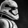 A close-up side view of a white, futuristic Stormtrooper helmet and suit with visible scratches and markings, set against a dark, blurred background inspired by Star Wars. Fantasy art poster available in A1 to A4 sizes.