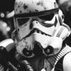 A close-up of a Stormtrooper with weathered helmet and armour, holding a blaster, in black and white—a gritty nod to the iconic Star Wars universe. Fantasy art poster available in A1 to A4 sizes.