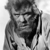 A wolf man with a thick beard and wild hair wears a torn, button-up shirt and looks intensely at the camera in black and white. Horror poster available in A1 to A4 sizes.
