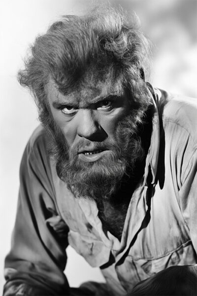 A wolf man with a thick beard and wild hair wears a torn, button-up shirt and looks intensely at the camera in black and white. Horror poster available in A1 to A4 sizes.