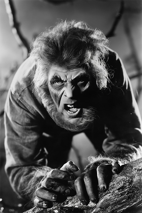product-image-2-3 A wolf man crouches on a rock, snarling with bared teeth and claws in a dramatic black-and-white scene. Horror poster available in A1 to A4 sizes.