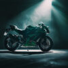 A green Kawasaki ZX10R sport motorcycle is parked in a dimly lit room, illuminated by a single overhead spotlight. Wall art print available in A1 to A4 sizes.