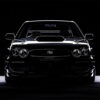 Front view of a black Subaru Impreza with prominent headlights and hood scoop, set against a dark background with dramatic lighting. Wall art print available in A1 to A4 sizes.