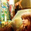 A woman holds a transparent umbrella in a brightly lit city with neon signs and a dinosaur statue on a building, evoking Sofia Coppolas 2003 movie Lost in Translation. Text reads Lost In Translation. Movie poster print available in A1 to A4 sizes.