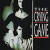 Poster for The Crying Game film showing a woman standing behind a seated man, both partially shadowed, with the movie title in bold letters to the right. Movie poster print available in A1 to A4 sizes.