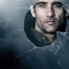 A man’s face appears through a hole in broken glass, with the text “Children of Men” displayed at the bottom—an iconic image from the 2006 movie. Movie poster print available in A1 to A4 sizes.