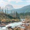 A mountain river winds through a forested valley with pine trees and rugged rocks, set against mountains in the background beneath a partly cloudy sky. Nature and landscape poster print available in A1 to A4 sizes.