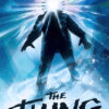 A silhouette of a person stands with rays of bright light and shards emanating from their head, capturing the chilling essence of the 1982 horror movie The Thing, with the title displayed prominently at the bottom. Movie poster print available in A1 to A4 sizes.