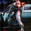 A robotic police officer stands by an open car door with flashing lights at night; the word ROBOCOP is displayed at the bottom, evoking the iconic 1987 Robocop movie. Movie poster print available in A1 to A4 sizes.