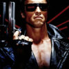 A man wearing sunglasses and a black leather jacket holds a handgun, with the word TERMINATOR in red letters at the bottom, capturing the iconic look from The Terminator (1984). Movie poster print available in A1 to A4 sizes.