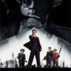 Movie poster for the 1987 movie The Untouchables, a classic crime film, featuring a large grayscale image of a man with a hat and cigar above four men in suits—one aiming a gun—with a city skyline in the background. Movie poster print available in A1 to A4 sizes.