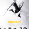 A boy jumps in the air holding a stick and shield above five smiling adults standing together; the word Belfast 2021 appears in yellow text below. Movie poster print available in A1 to A4 sizes.