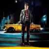 A man stands in front of a yellow taxi at night on a city street; the text TAXI DRIVER appears in bold red letters at the bottom, referencing Martin Scorseses iconic 1976 movie. Movie poster print available in A1 to A4 sizes.
