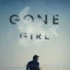 A man stands by a body of water under a cloudy sky with GONE GIRL above him; the 2014 movie stars Ben Affleck and Rosamund Pike, whose names are credited at the top. Movie poster print available in A1 to A4 sizes.