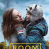 A woman smiles as she lifts a young boy wearing a panda hat. They are outdoors with a blue sky and trees. The word ROOM appears at the bottom in yellow text. Movie poster print available in A1 to A4 sizes.