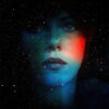 A womans face blending with a star-filled cosmic background, illuminated by blue and red light, evokes the mysterious atmosphere of the 2013 movie Under the Skin starring Scarlett Johansson, with the text UNDER THE SKIN at the bottom. Movie poster print available in A1 to A4 sizes.