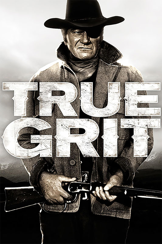 A man in a cowboy hat and coat holds a rifle in front of large text that reads TRUE GRIT. This dramatic black and white image captures the spirit of the classic 1969 film. Movie poster print available in A1 to A4 sizes.