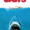 A swimmer on the ocean surface with a large shark approaching from below; the word JAWS in bold red letters at the top. Movie poster print available in A1 to A4 sizes.