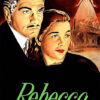 A man and woman stand close together with serious expressions; a ghostly woman looms above a burning mansion in the background. The text Rebecca is at the bottom, hinting at the suspense of this Alfred Hitchcock classic thriller. Movie poster print available in A1 to A4 sizes.