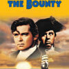 1935 movie poster for Mutiny on the Bounty featuring two men in historical naval attire, a sailing ship, and a lifeboat at sea with a sunset in the background. Movie poster print available in A1 to A4 sizes.