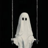 A figure covered in a white sheet with eye holes sits on a swing against a black background, evoking the nostalgic charm of a vintage poster and capturing the eerie spirit of Halloween. A1 to A4 poster print.