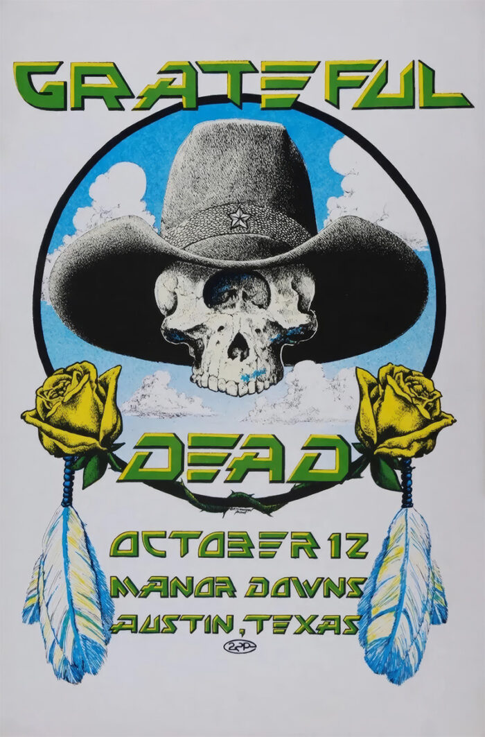 product-image Poster for a Grateful Dead concert at Manor Downs features a skull in a cowboy hat, yellow roses, and blue feathers. Text highlights the event date, October 12, and location in Austin Texas. Poster prints available in A1 to A4 sizes.