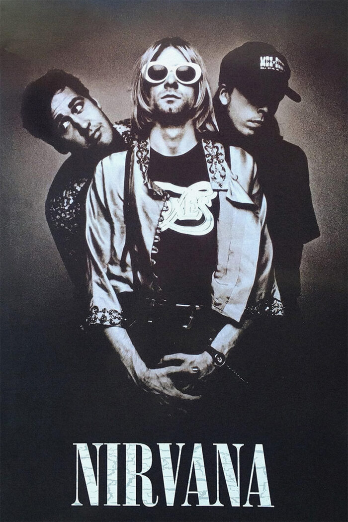 product-image Three members of Nirvana pose together in this black and white photo; one stands in front wearing sunglasses, with the band name NIRVANA displayed at the bottom like a classic music poster. Poster prints available in A1 to A4 sizes.