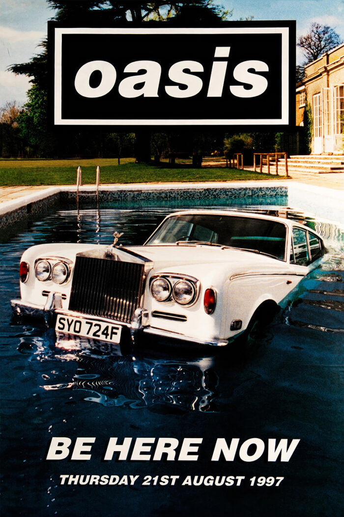 product-image A Rolls-Royce car is submerged in a swimming pool outside a building, with Concert Poster style text overlaid: Oasis and Be Here Now Thursday 21st August 1997. Poster prints available in A1 to A4 sizes.